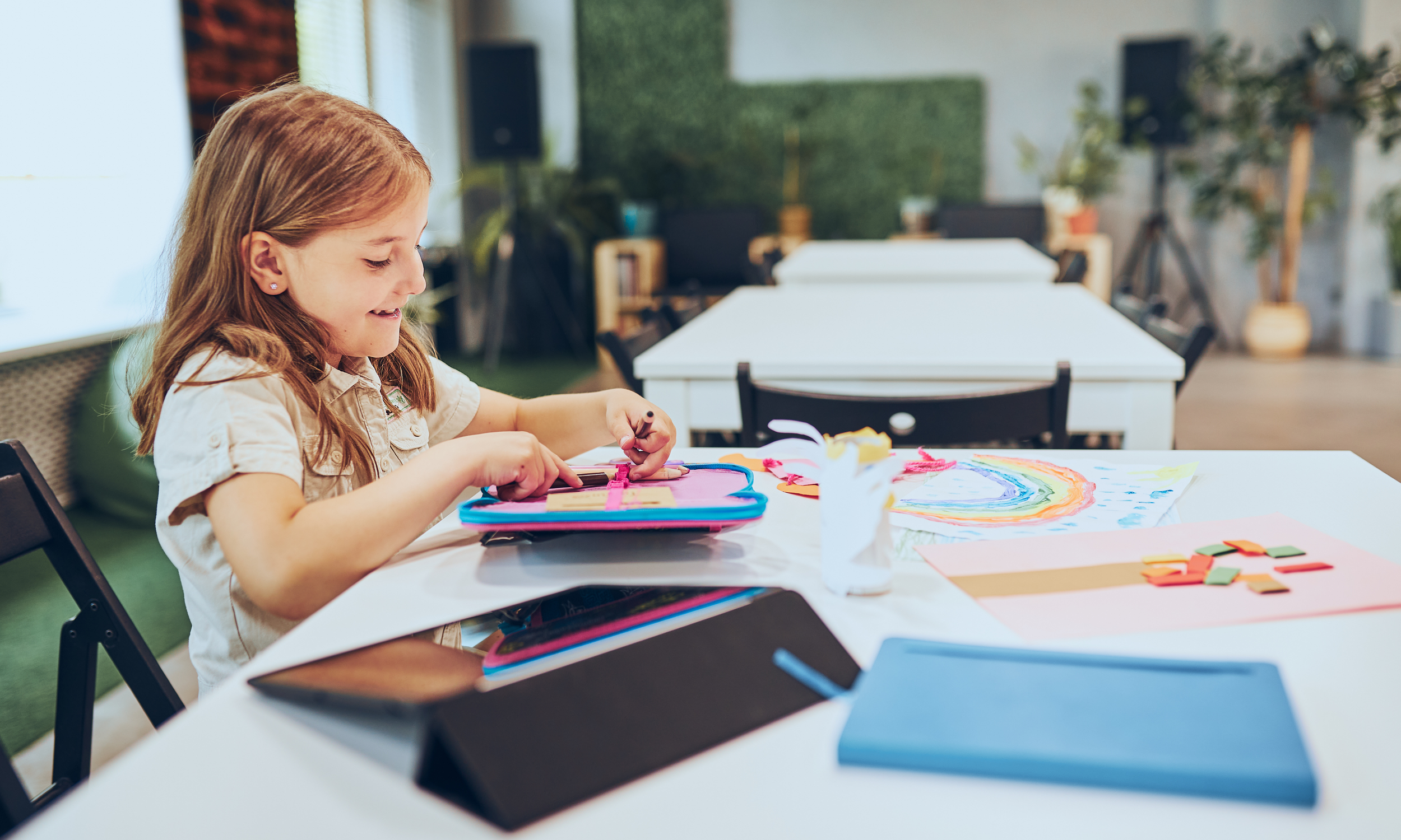 A child drawing and working on a creative activity
