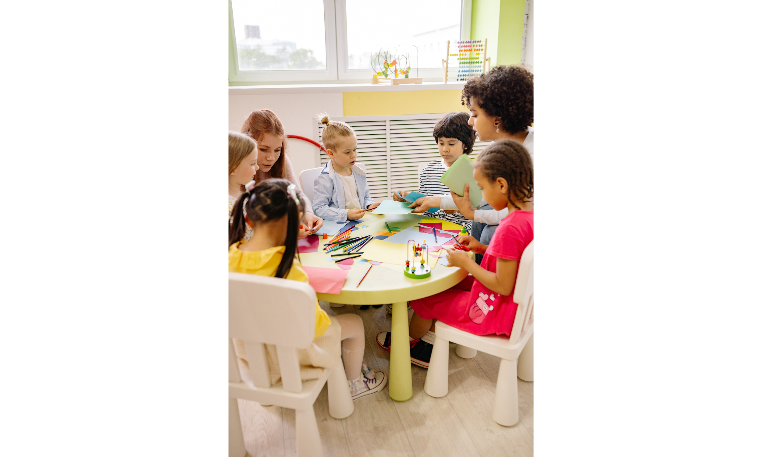 Children painting and making crafts together during a summer program