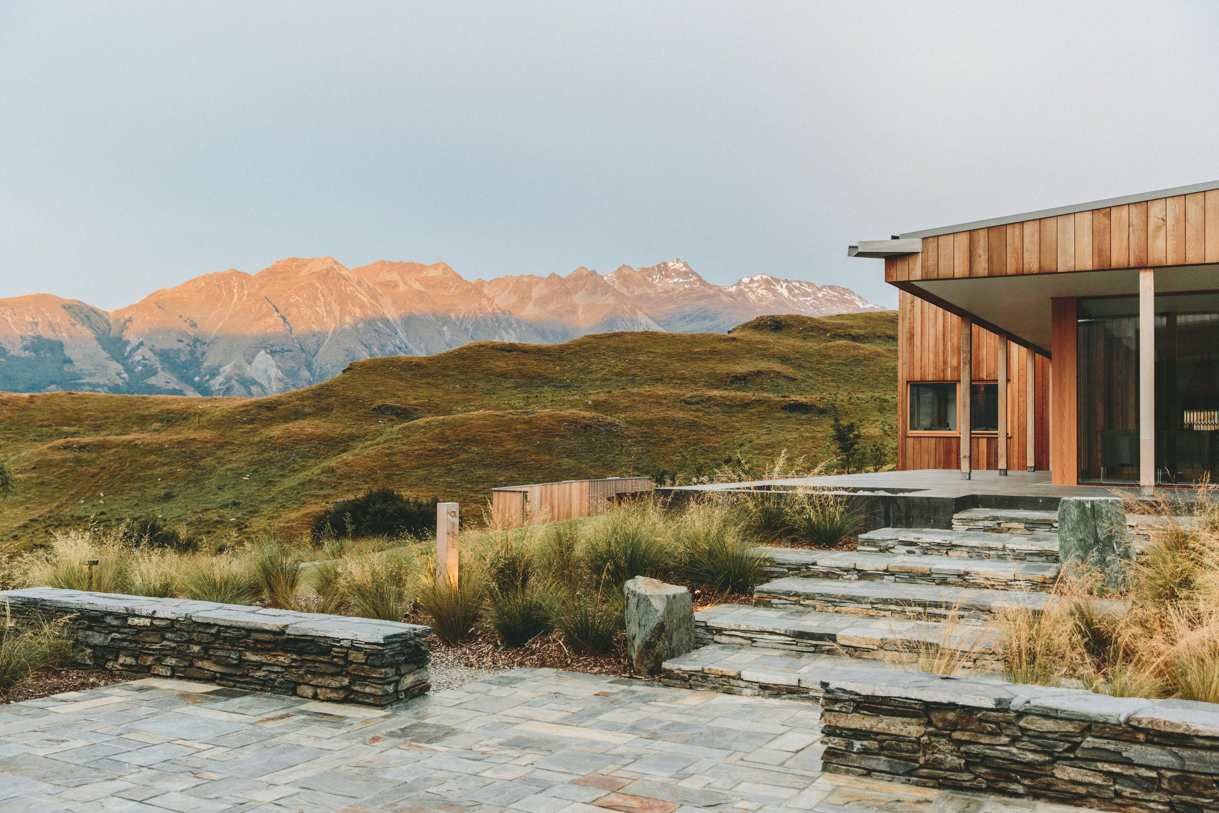 A peaceful modern home surrounded by mountain scenery